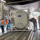 Oxygen tank is loaded into aircraft to supply hospitals in India, at Changi Airport in Singapore